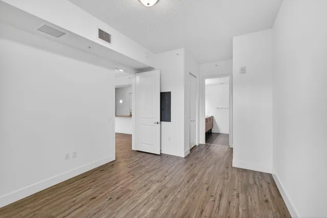 a garden view with tall buildings and plants