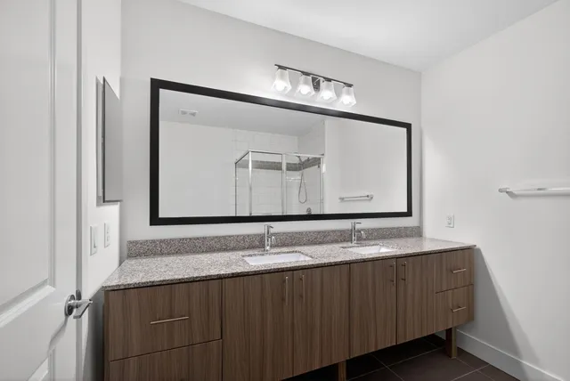 a living room with furniture a rug and a flat screen tv