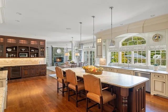 a large kitchen with a table and chairs