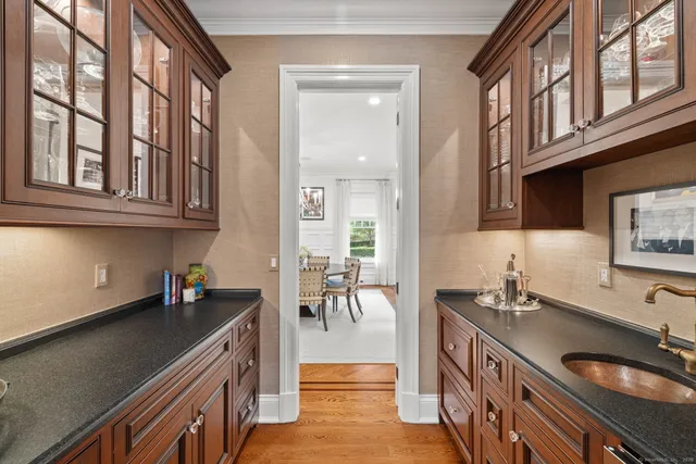 a kitchen with stainless steel appliances a sink and cabinets