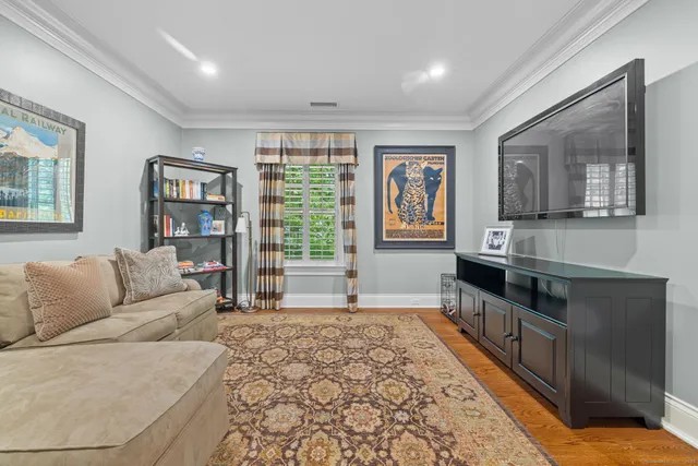 a living room with furniture and large window