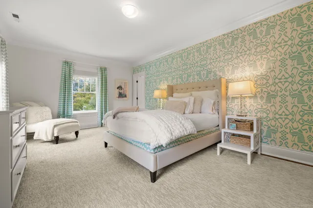 a bedroom with a bed and a couch