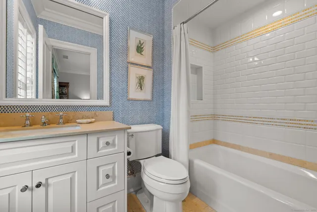 a bathroom with a sink a toilet and a bathtub
