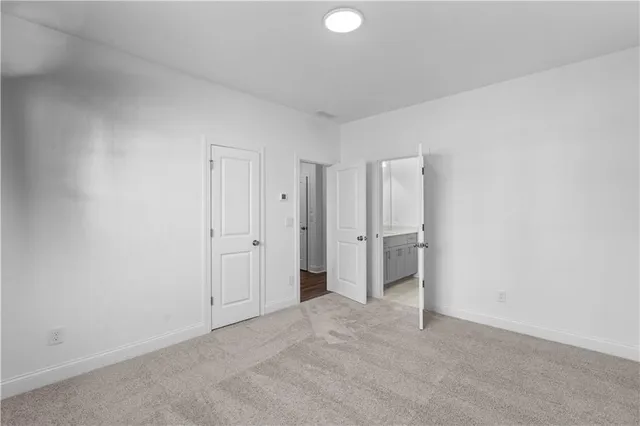 a view of an empty room and closet