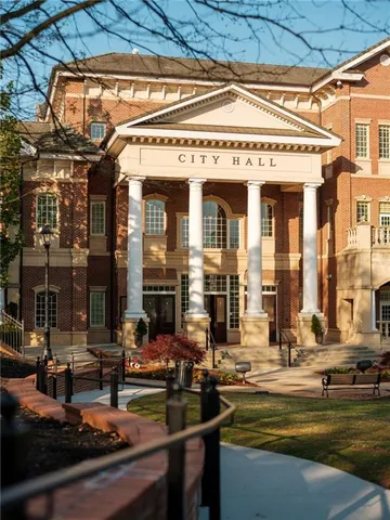 a view of a swimming pool with a yard and mountain view