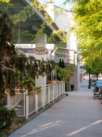 a view of a chairs and table in backyard
