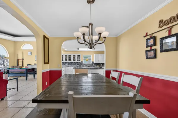 a living room with a piano and a table