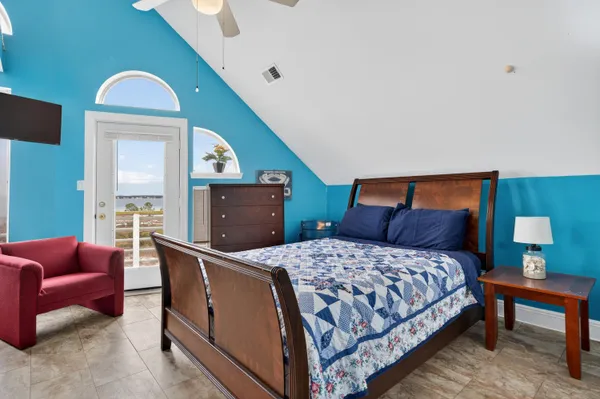 a bedroom with a bed and a dresser