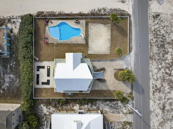 an aerial view of a house with a lake view