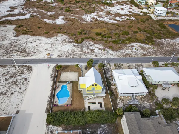 an aerial view of a house having swimming pool