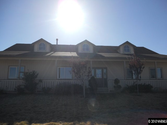 100 John Thomas Lane Reno, NV 89508 - Photo 1 of 13 a front view of a house with a yard