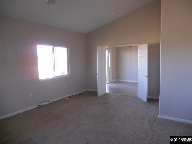 100 John Thomas Lane Reno, NV 89508 - Photo 3 of 13 an empty room that has a window