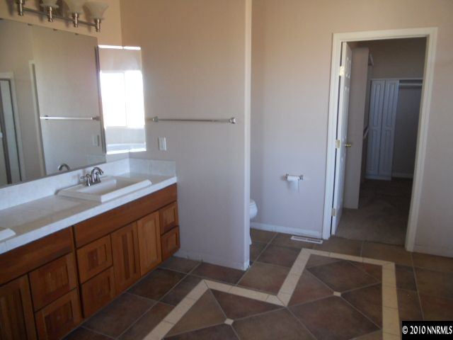 100 John Thomas Lane Reno, NV 89508 - Photo 5 of 13 a bathroom with a sink and a mirror