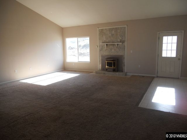 100 John Thomas Lane Reno, NV 89508 - Photo 6 of 13 a view of empty room with a fireplace