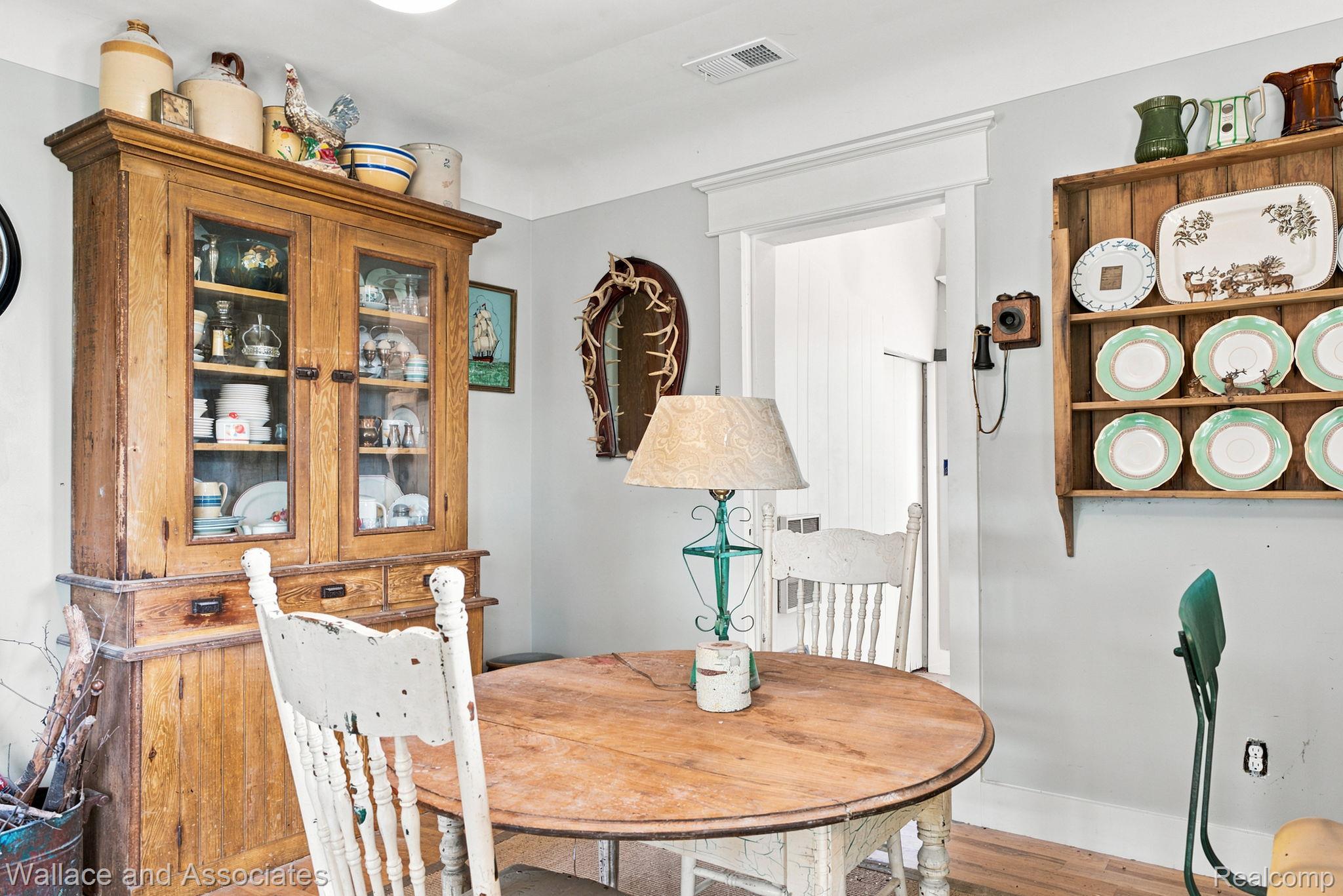 5949 Roach Road Croswell, MI 48422 - Photo 19 of 48 Dining area featuring light wood flooring, a light gray wall color, and white trim work