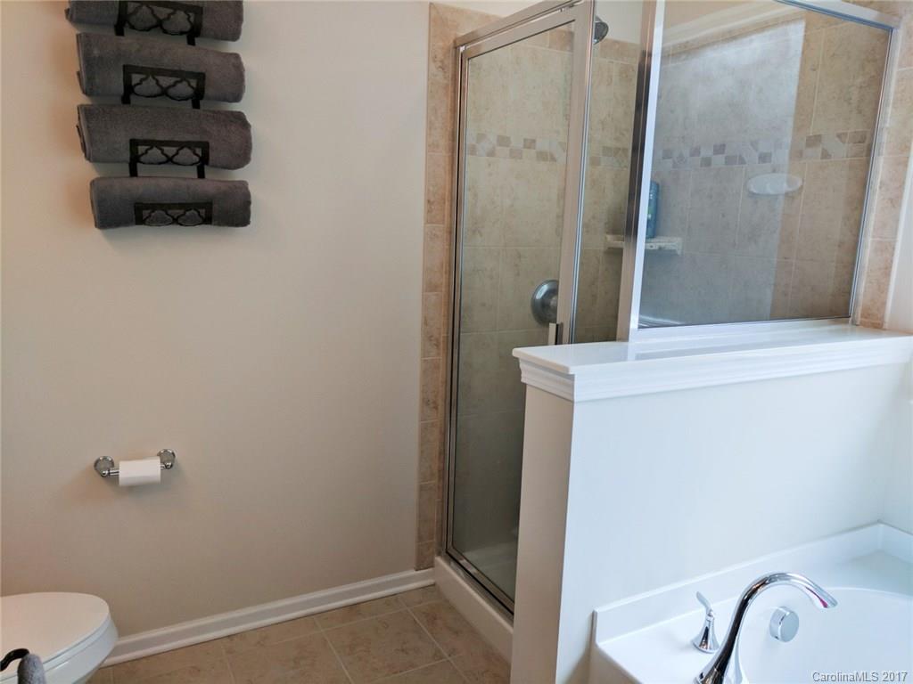 78102 Rillstone Drive Lancaster, SC 29720 - Photo 14 of 22 a bathroom with a sink a toilet and shower