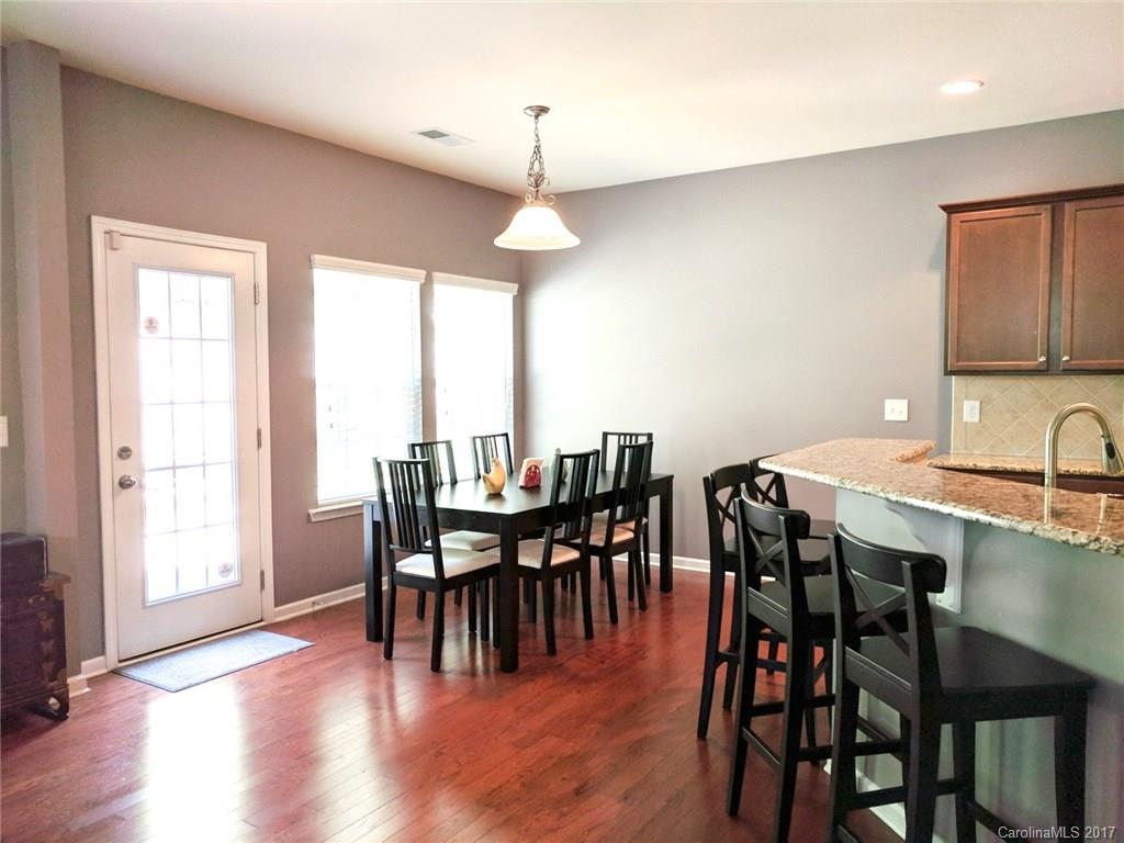 78102 Rillstone Drive Lancaster, SC 29720 - Photo 5 of 22 a view of a a dining room with furniture window and wooden floor