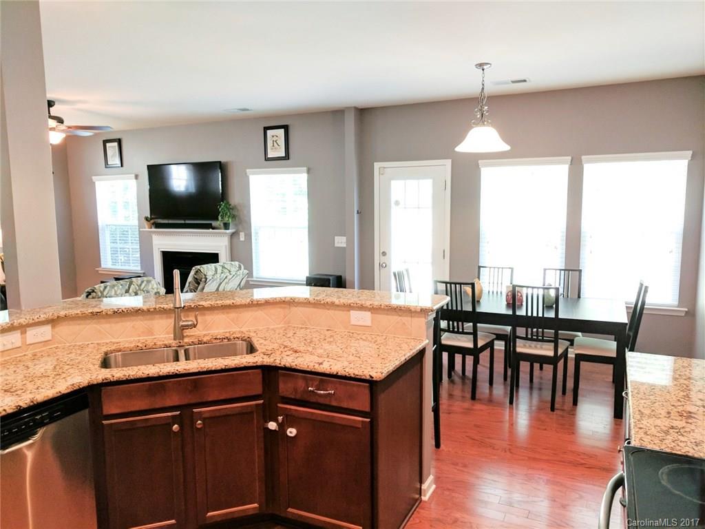 78102 Rillstone Drive Lancaster, SC 29720 - Photo 8 of 22 a kitchen with stainless steel appliances granite countertop a sink and stove