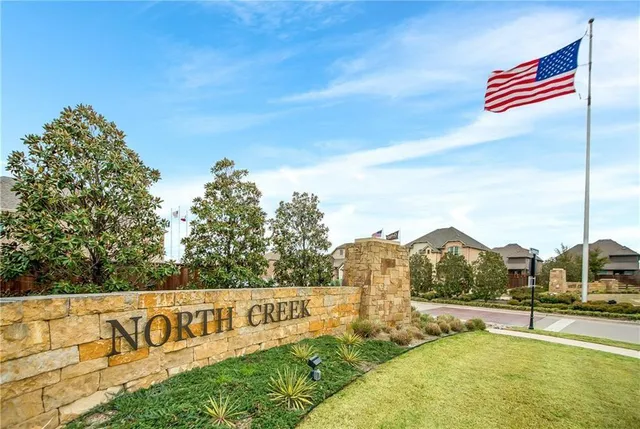 a view of a yard with cars