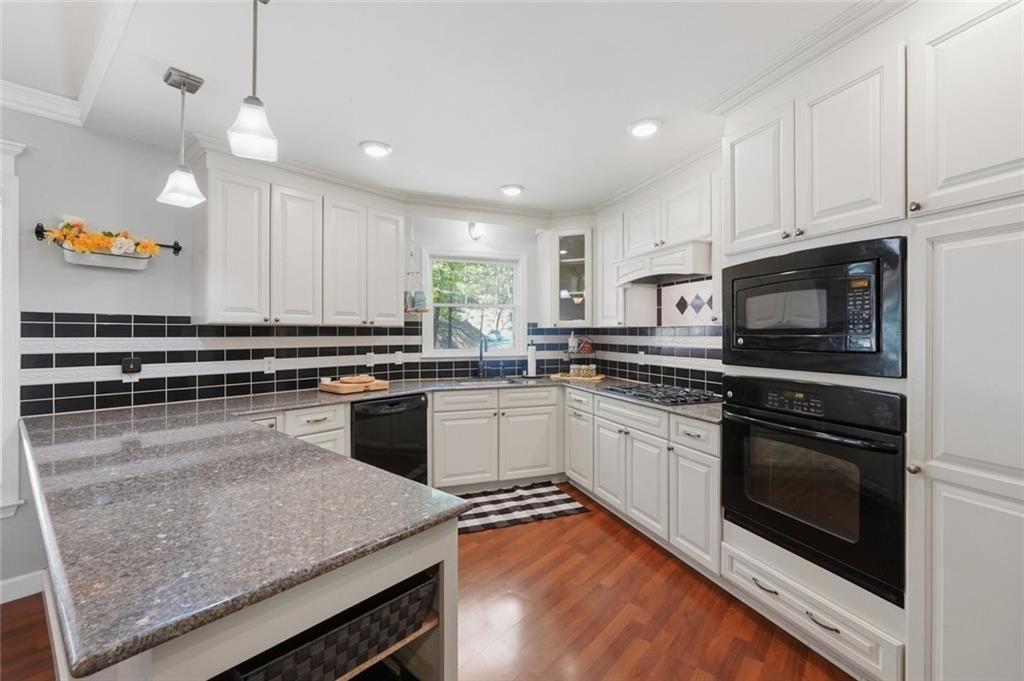 25 Valley View Vista Jasper, GA 30143 - Photo 6 of 58 a kitchen with stainless steel appliances granite countertop a stove top oven a sink and a microwave