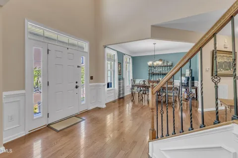 a spacious bathroom with a toilet sink and a mirror