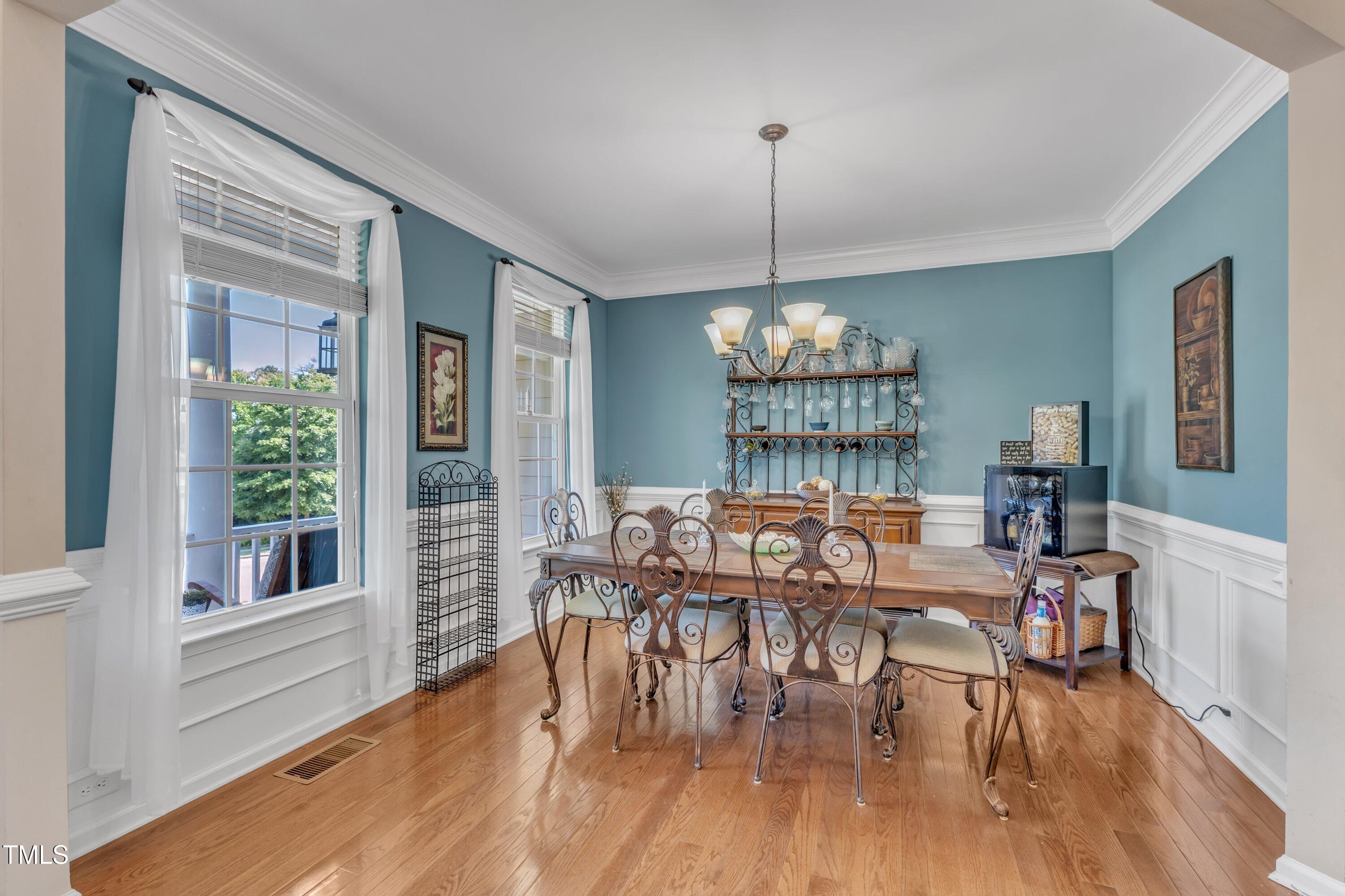 533 Opposition Way Wake Forest, NC 27587 - Photo 11 of 87 a view of a dining room with furniture window and wooden floor