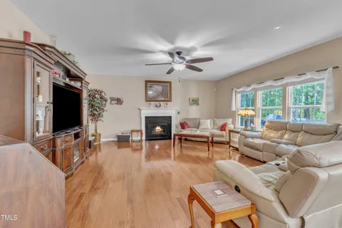 a kitchen with stainless steel appliances granite countertop a refrigerator a stove and a sink