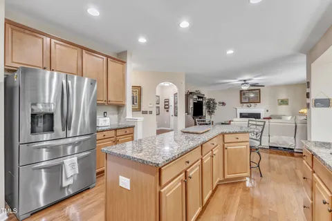 a view of a workspace with furniture and a book shelf