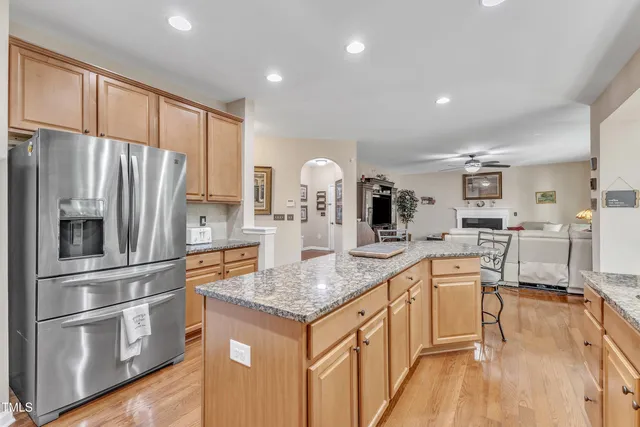 a view of a patio with table and chairs under an umbrella