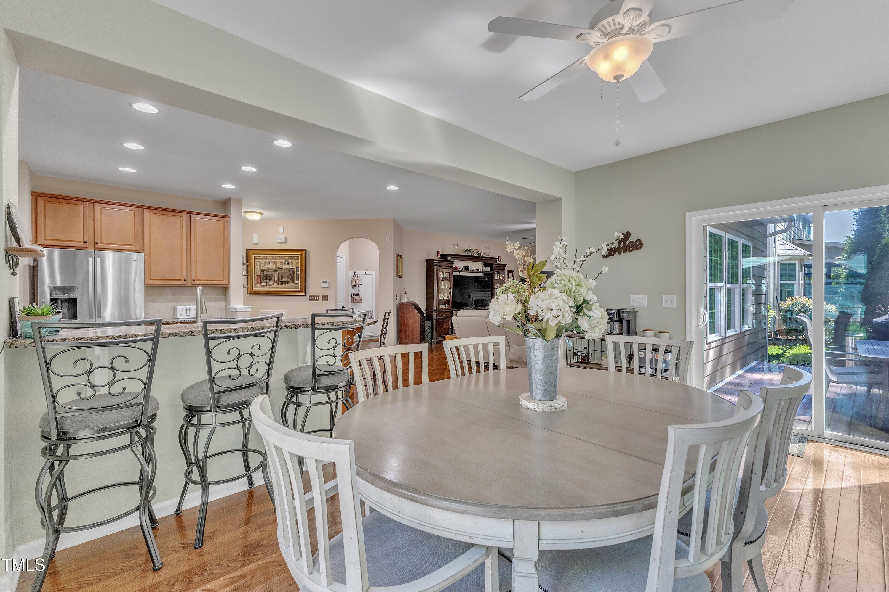 533 Opposition Way Wake Forest, NC 27587 - Photo 33 of 87 a dining room filled chandelier and wooden floor