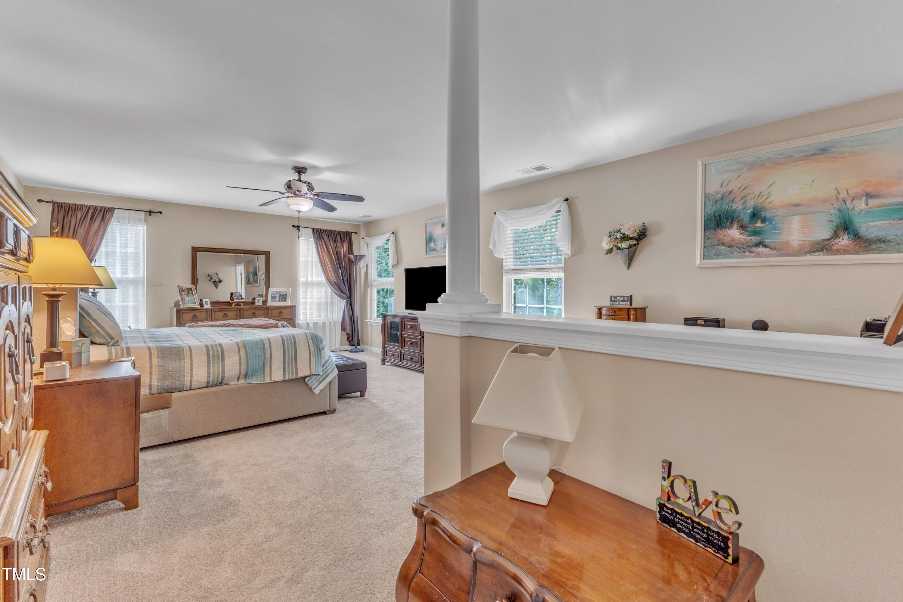 533 Opposition Way Wake Forest, NC 27587 - Photo 46 of 87 a living room with furniture and a wooden floor