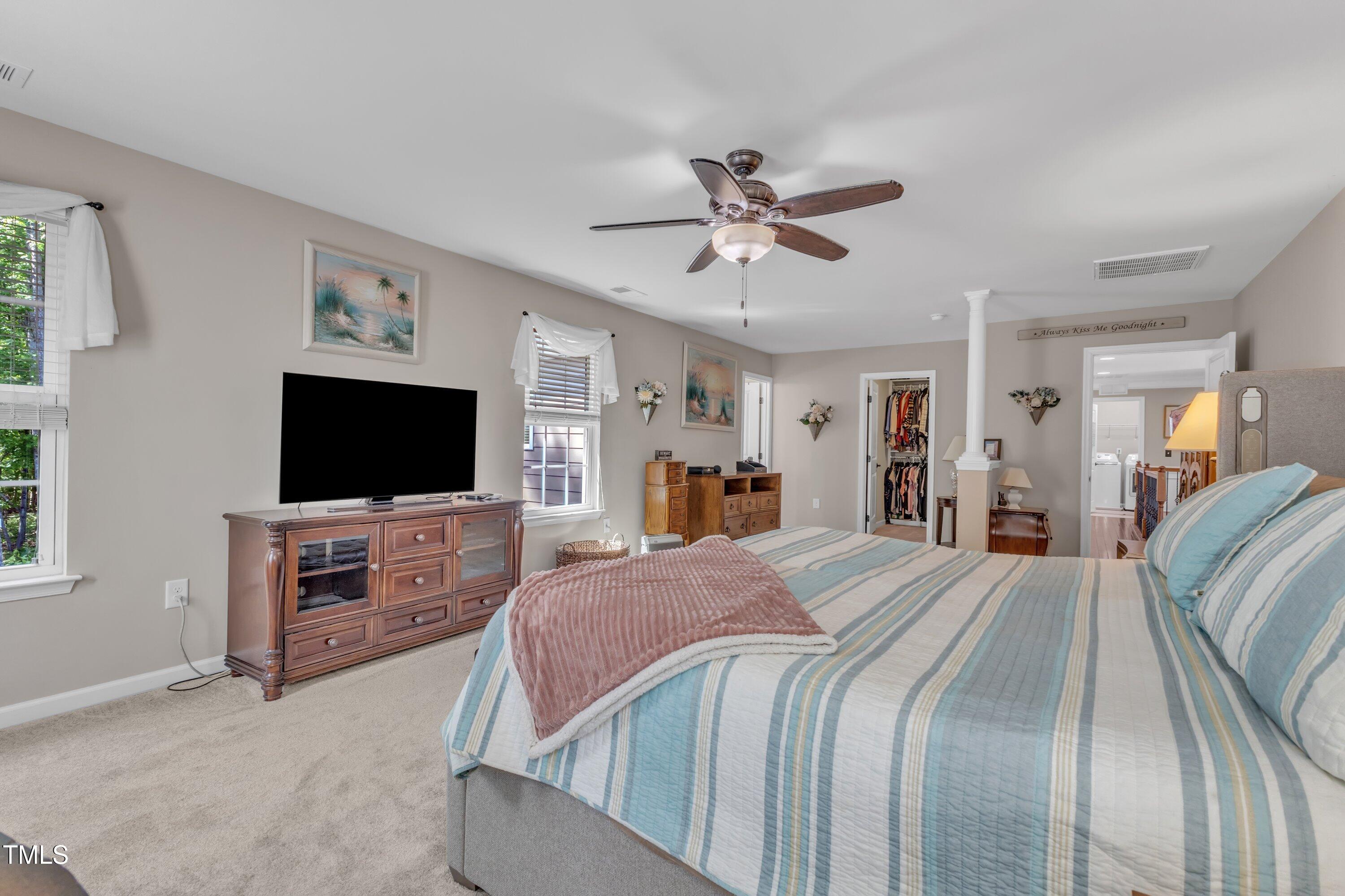533 Opposition Way Wake Forest, NC 27587 - Photo 50 of 87 a bedroom with a bed and a flat screen tv