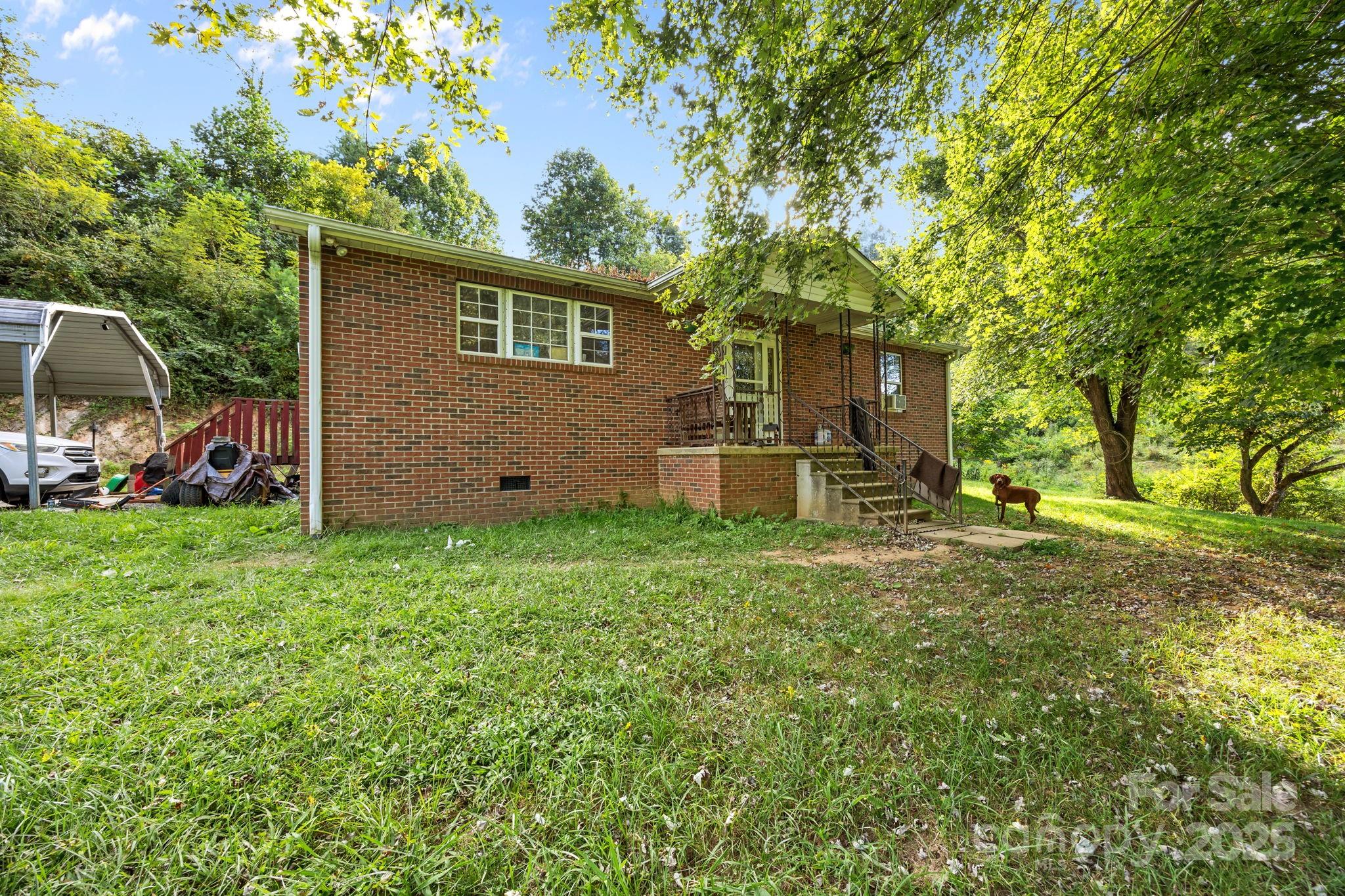 590 Sweet Water Road Marshall, NC 28753 - Photo 1 of 17 front view of a house with a big yard