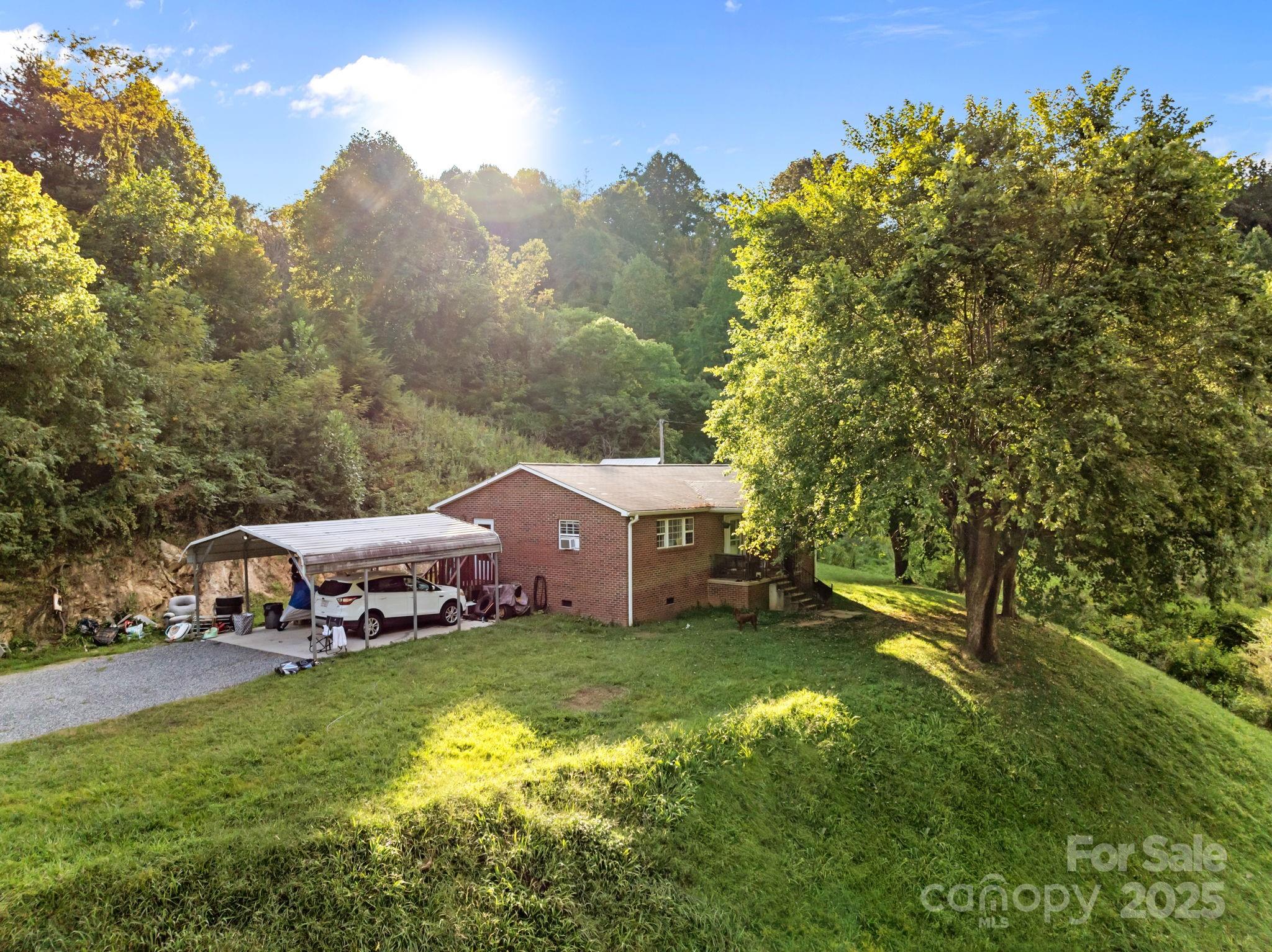 590 Sweet Water Road Marshall, NC 28753 - Photo 3 of 17 a view of a house with a big yard