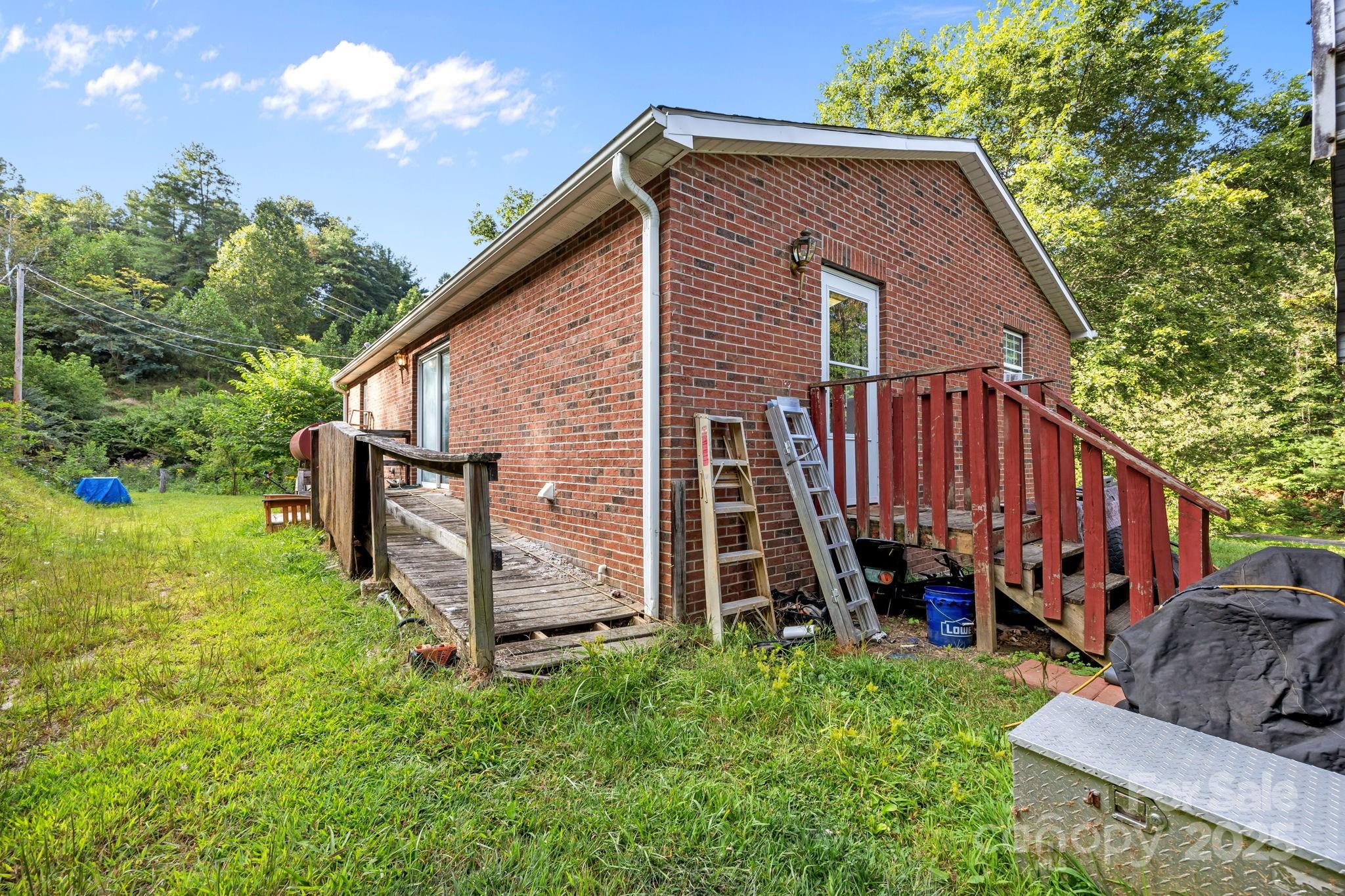 590 Sweet Water Road Marshall, NC 28753 - Photo 4 of 17 a view of a house with backyard
