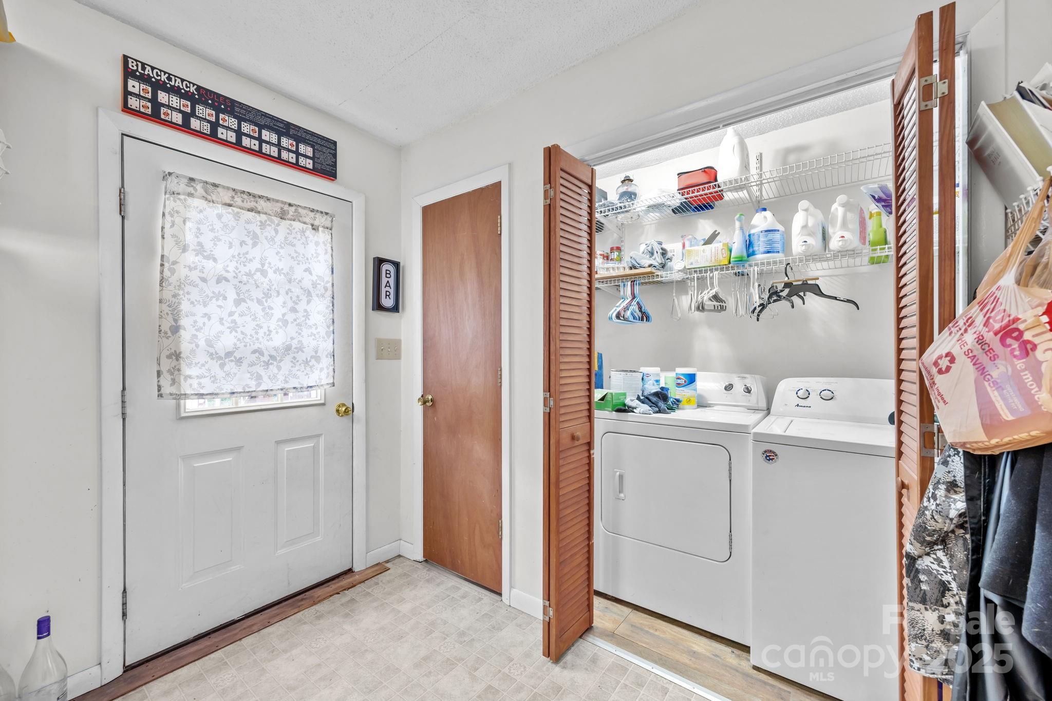 590 Sweet Water Road Marshall, NC 28753 - Photo 7 of 17 a room with storage and utility