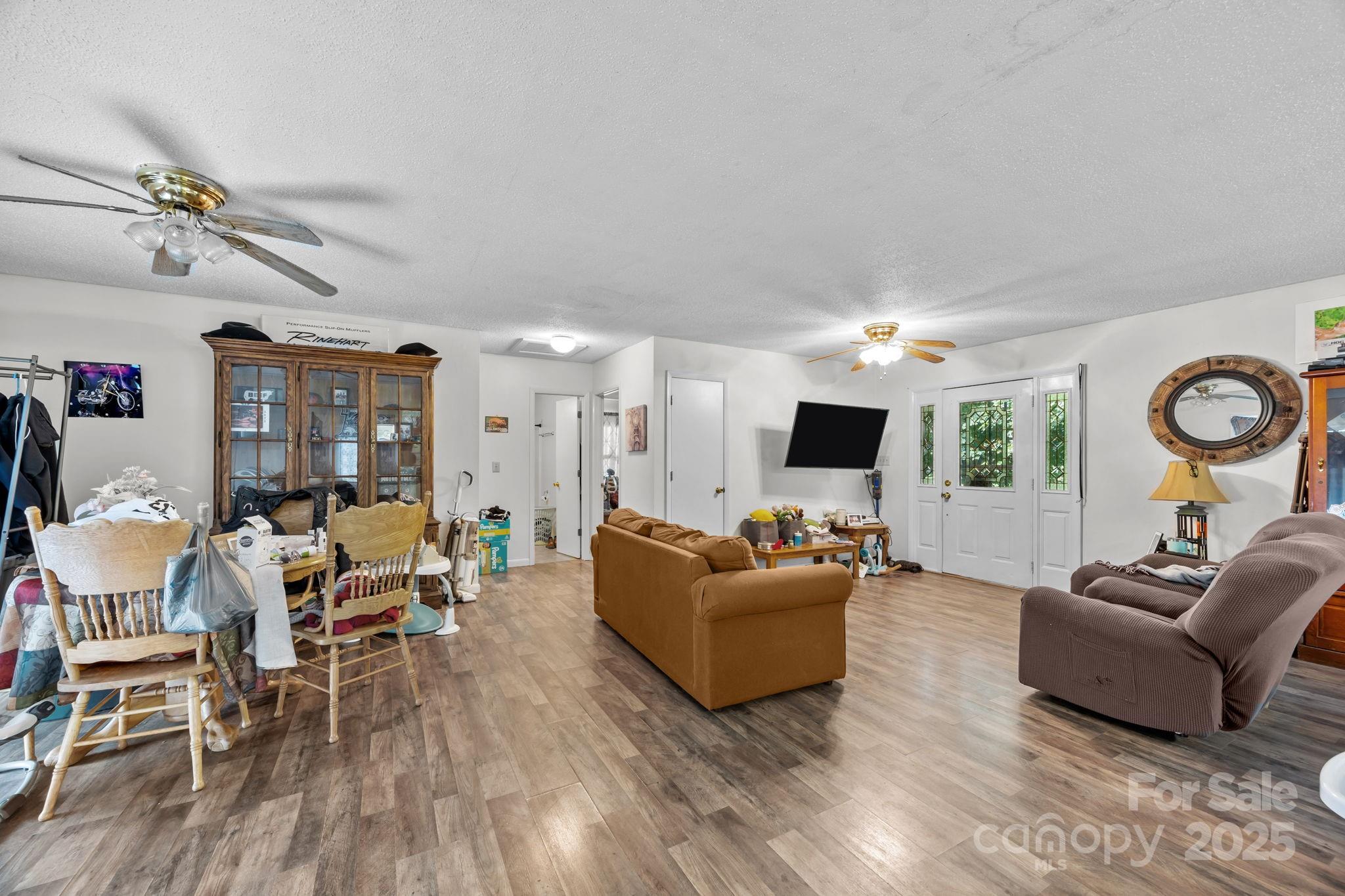 590 Sweet Water Road Marshall, NC 28753 - Photo 8 of 17 a living room with furniture and wooden floor