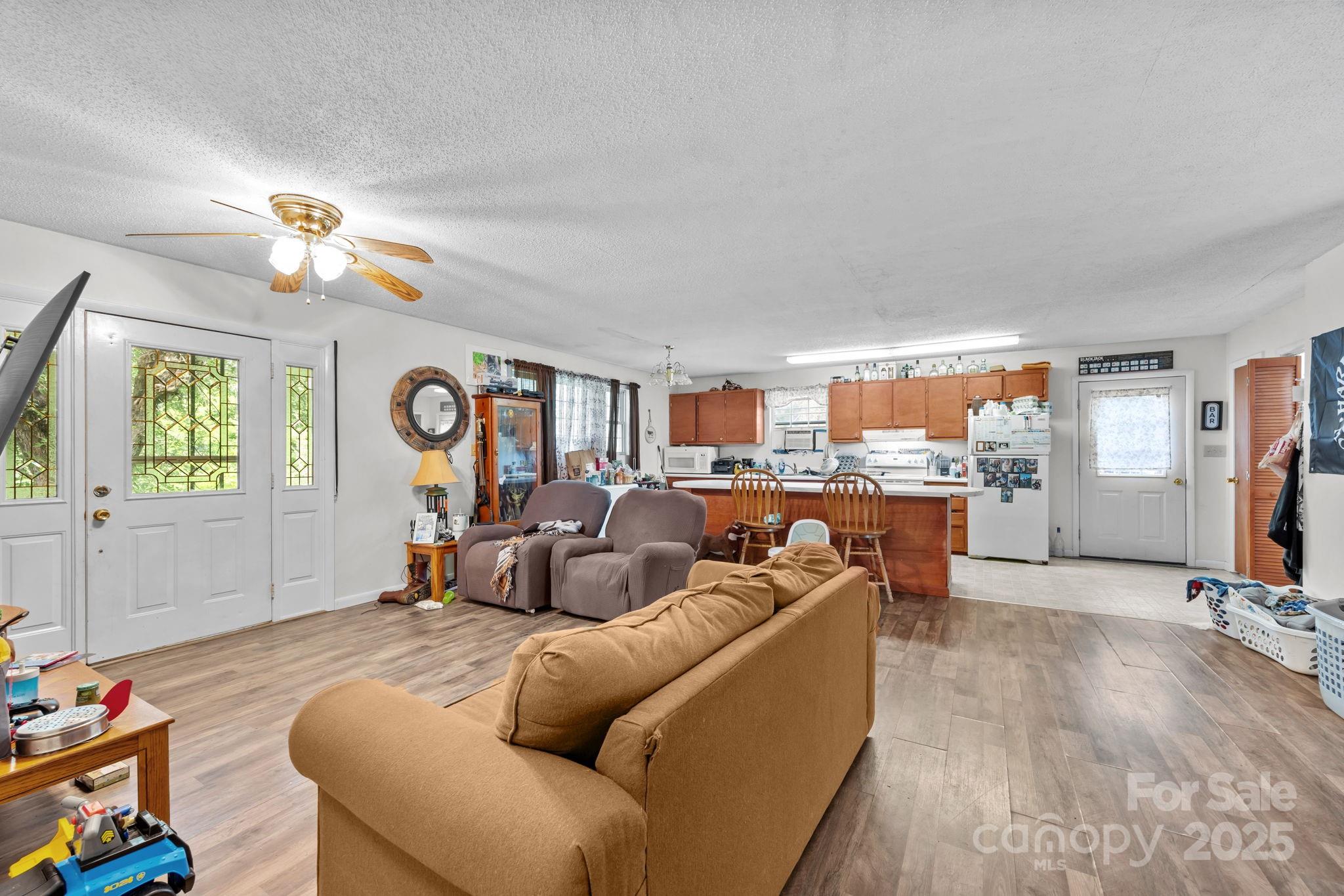 590 Sweet Water Road Marshall, NC 28753 - Photo 9 of 17 a living room with furniture kitchen view and a window