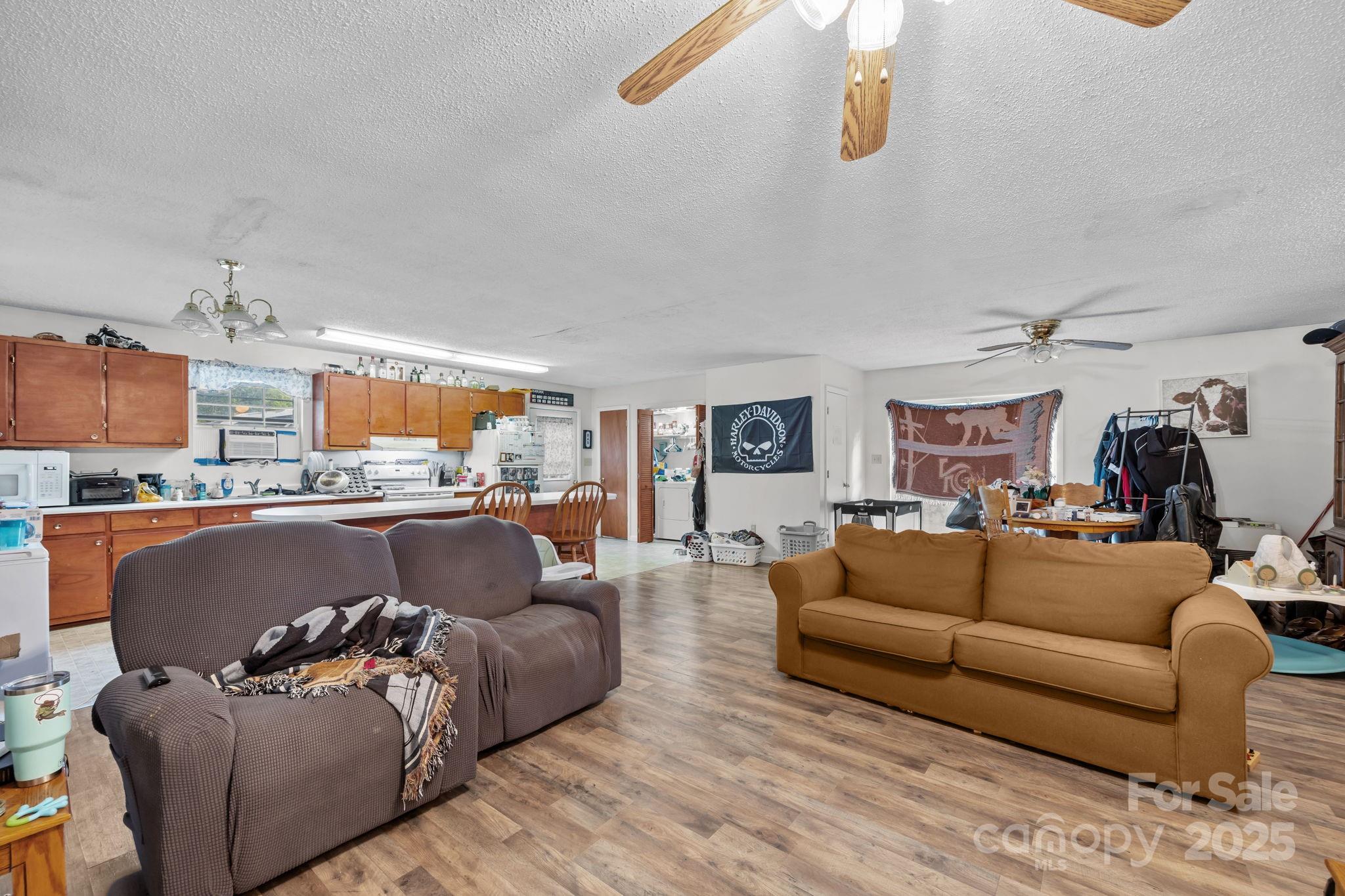 590 Sweet Water Road Marshall, NC 28753 - Photo 10 of 17 a living room with furniture and a large window