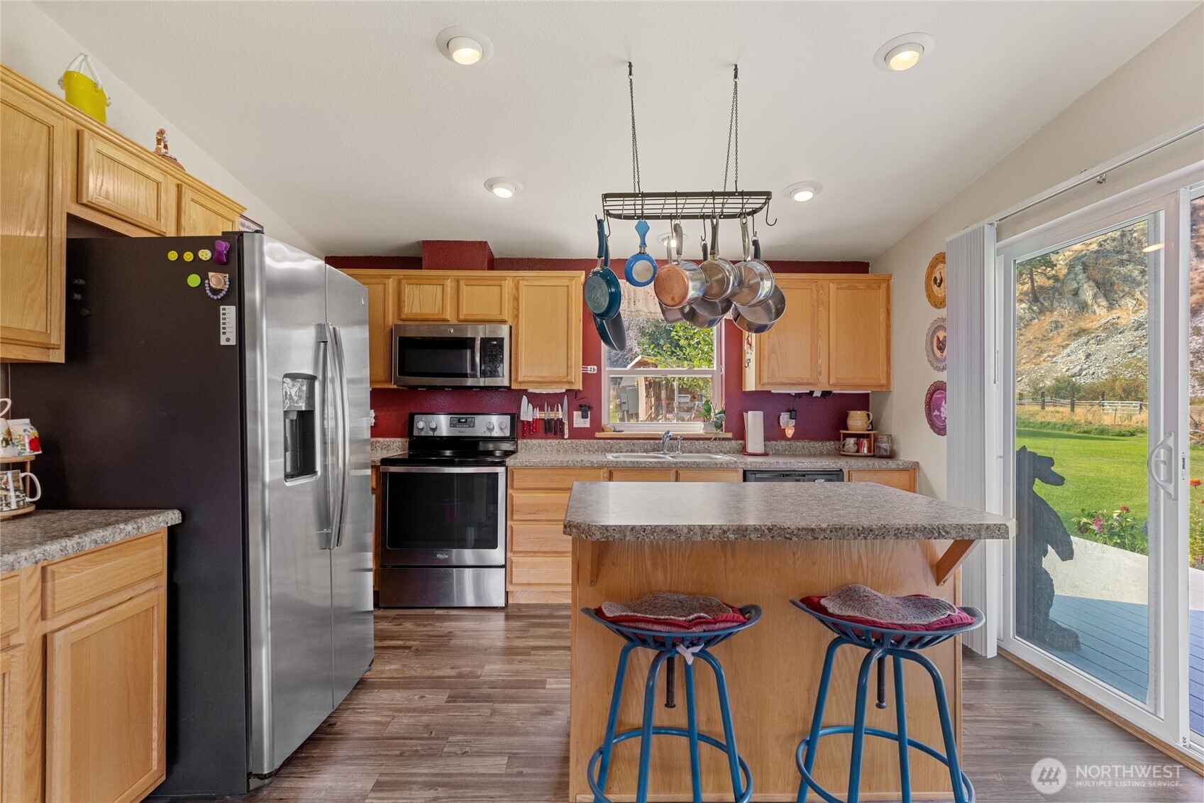 2560 Antoine Creek Road Chelan, WA 98816 - Photo 14 of 38 a kitchen with stainless steel appliances granite countertop a stove a refrigerator and a refrigerator
