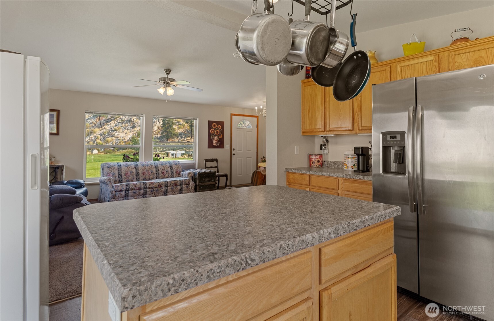 2560 Antoine Creek Road Chelan, WA 98816 - Photo 16 of 38 a kitchen with stainless steel appliances granite countertop a sink a oven a counter space and stainless steel appliances