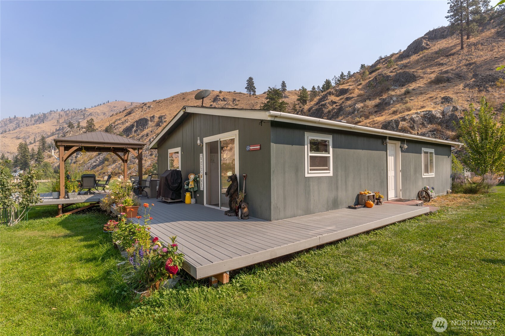 2560 Antoine Creek Road Chelan, WA 98816 - Photo 2 of 38 a view of a house with backyard and sitting area
