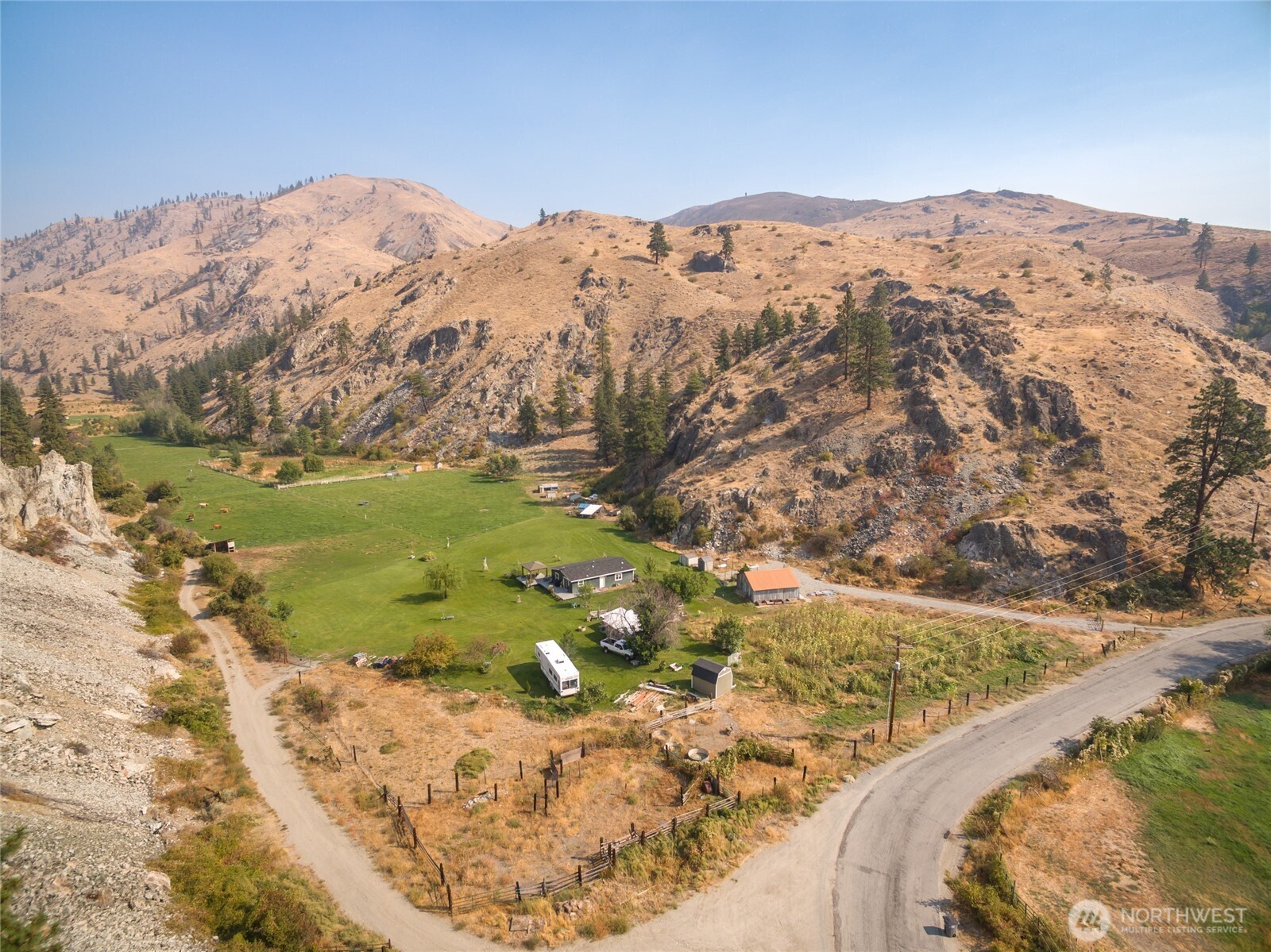2560 Antoine Creek Road Chelan, WA 98816 - Photo 24 of 38 a view of a mountain from a yard