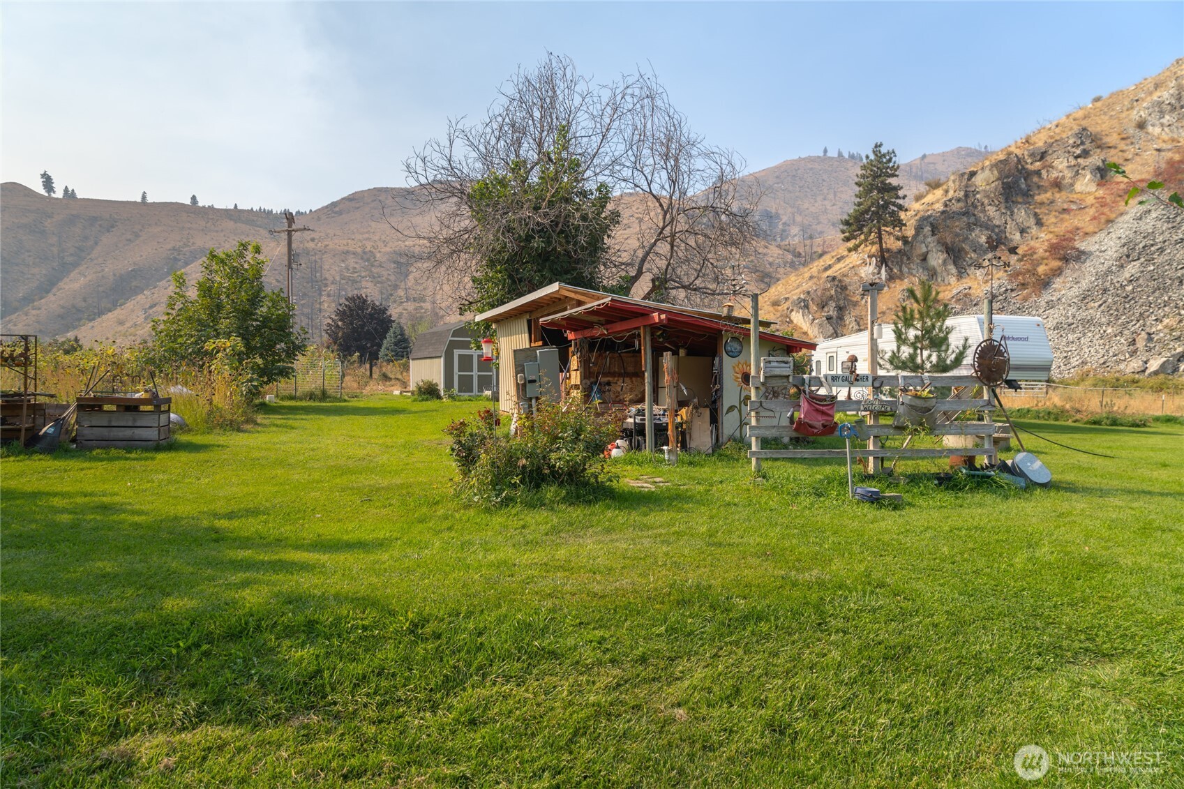 2560 Antoine Creek Road Chelan, WA 98816 - Photo 35 of 38 a view of a house with a yard porch and sitting area