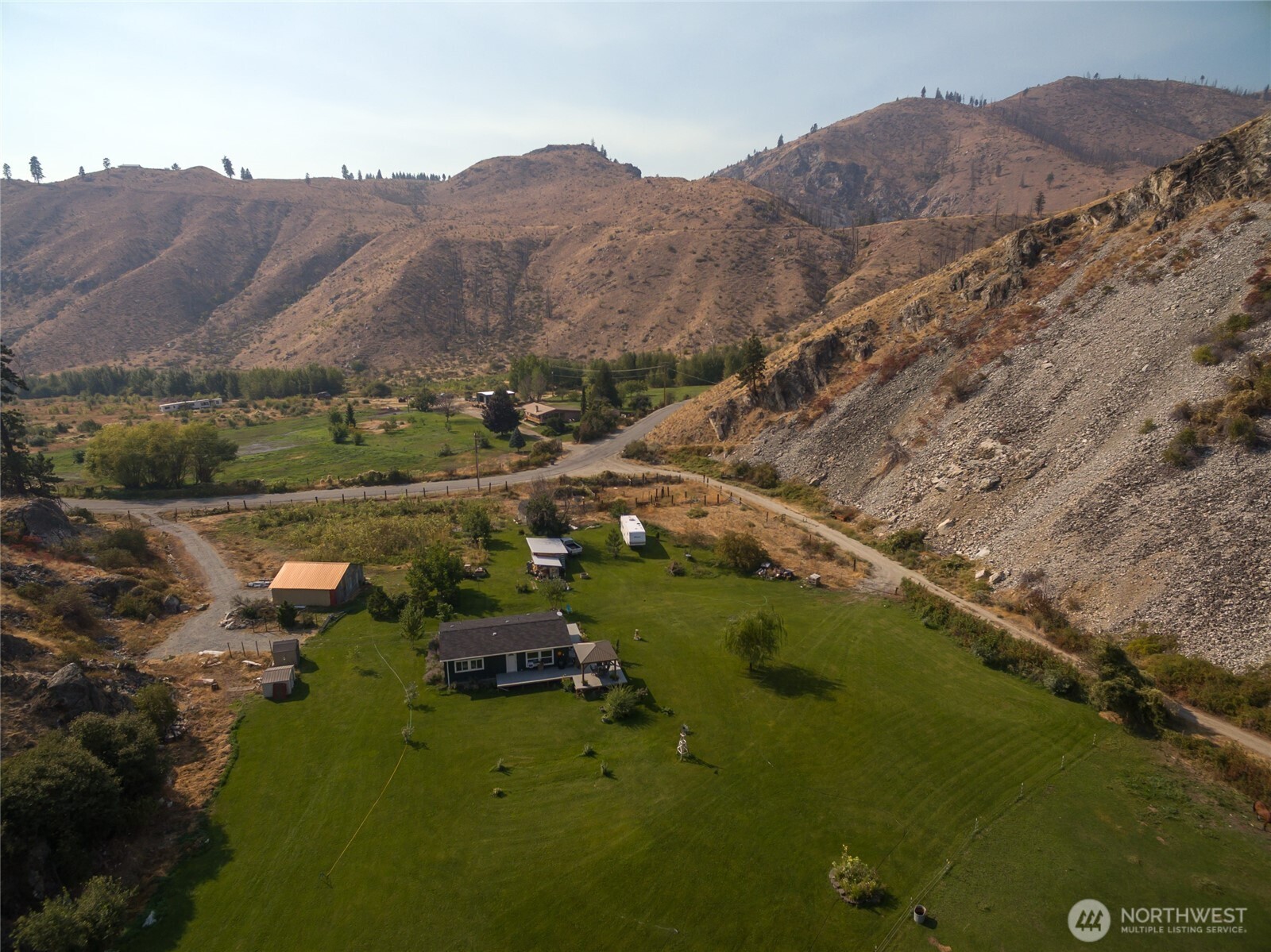2560 Antoine Creek Road Chelan, WA 98816 - Photo 38 of 38 a view of a lake with mountains in the background