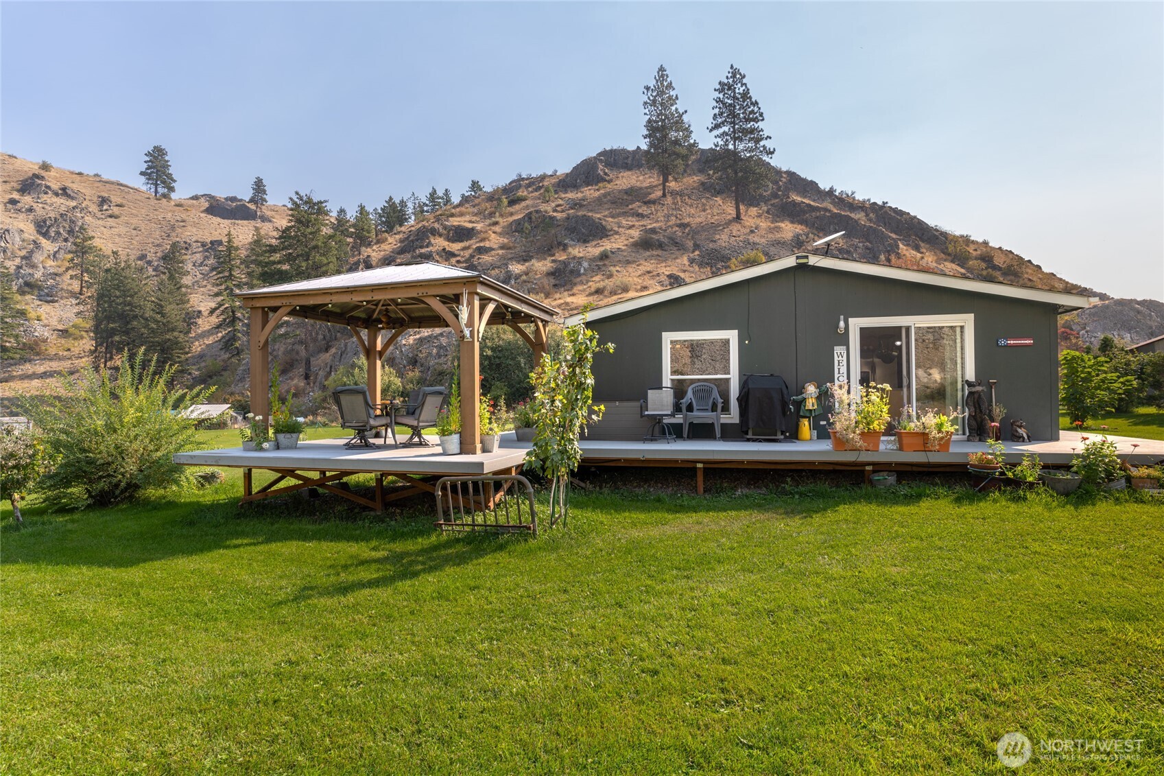2560 Antoine Creek Road Chelan, WA 98816 - Photo 6 of 38 a view of a house with garden and sitting area