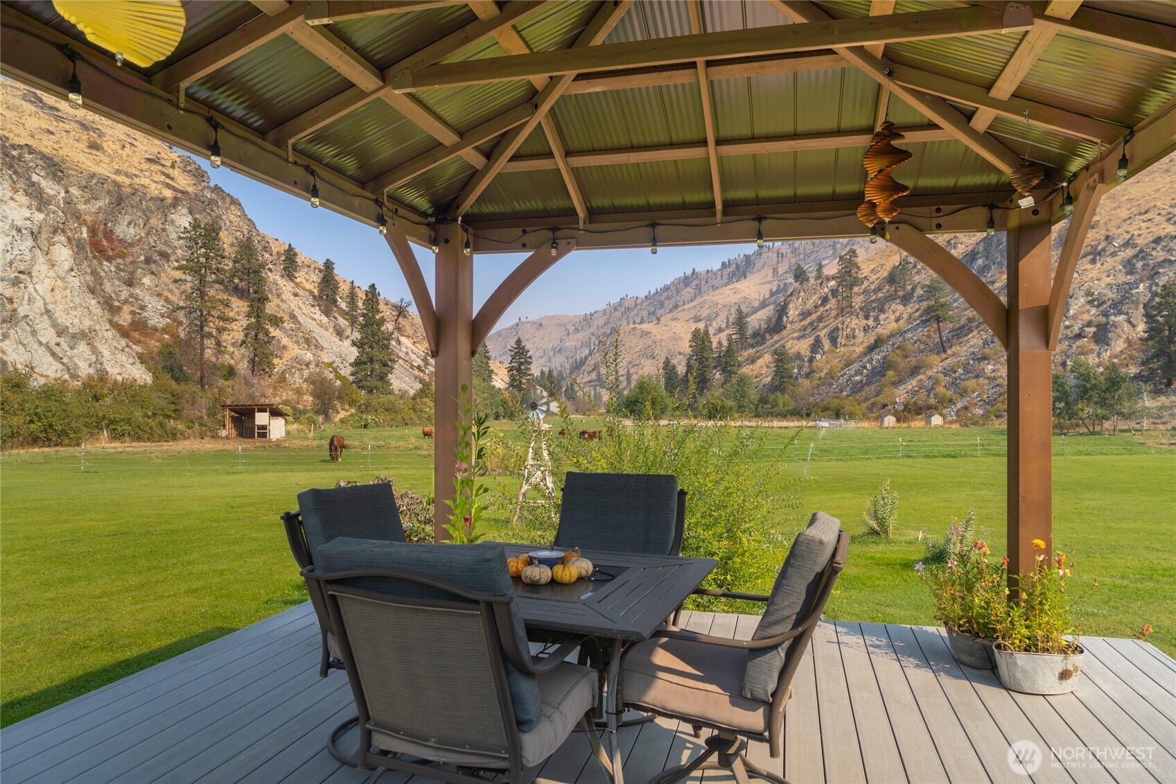 2560 Antoine Creek Road Chelan, WA 98816 - Photo 10 of 38 a view of a chair and table in the patio next to a yard