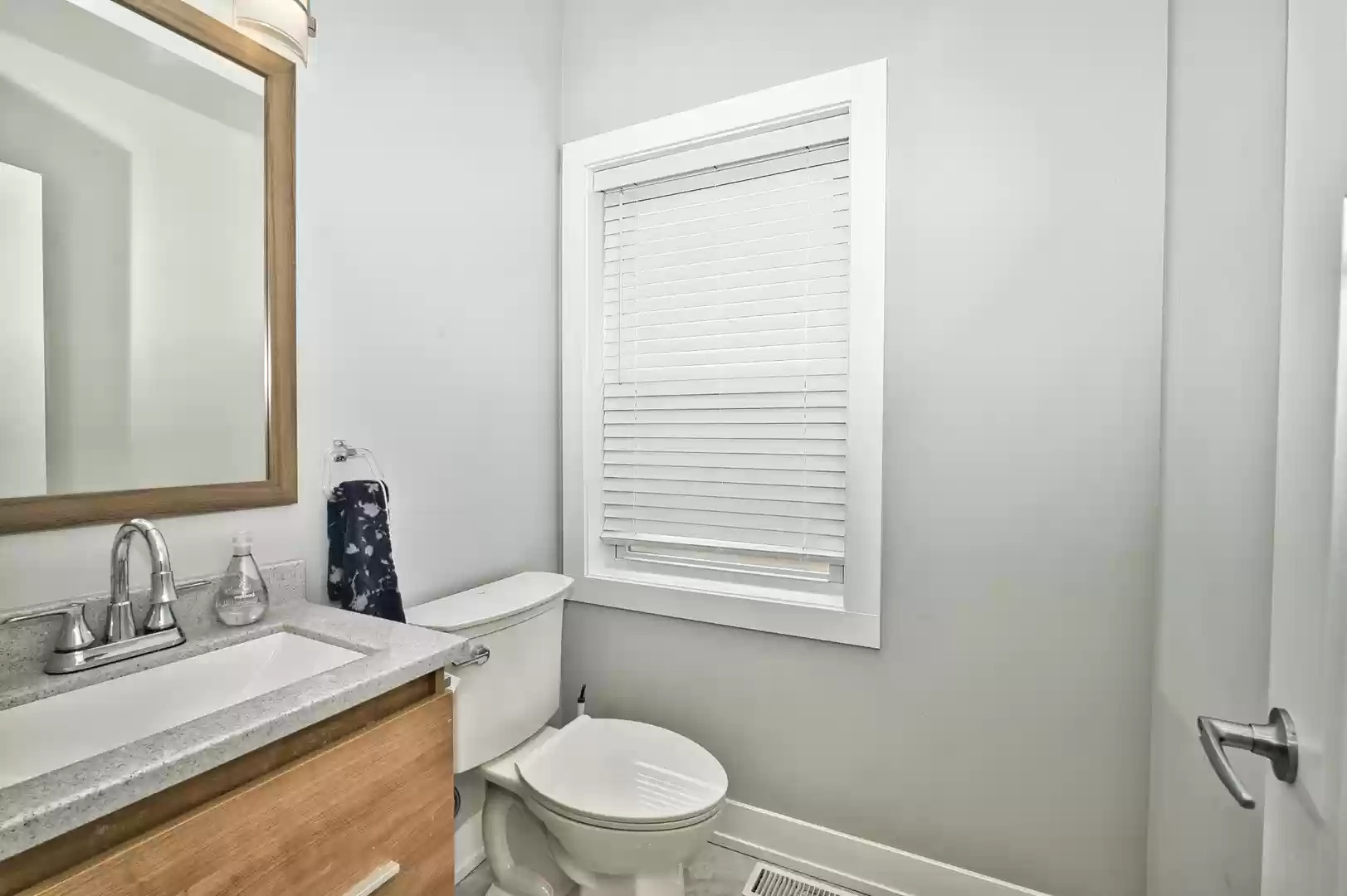 643 Oriole Avenue Park Ridge, IL 60068 - Photo 15 of 31 a bathroom with a granite countertop sink toilet and mirror