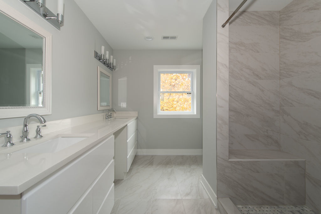 643 Oriole Avenue Park Ridge, IL 60068 - Photo 22 of 31 a bathroom with a granite countertop sink a toilet and shower