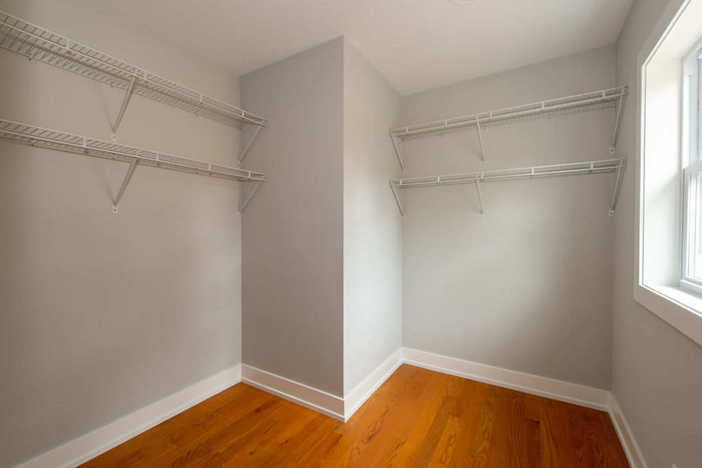 643 Oriole Avenue Park Ridge, IL 60068 - Photo 25 of 31 a view of an empty room with wooden floor and a window